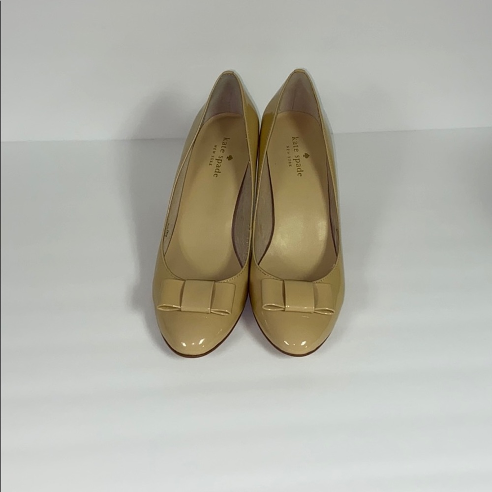 Nude Kate Spade pumps with bow